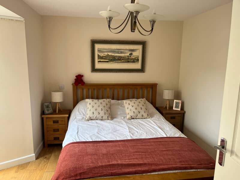 Main bedroom with oak-framed double bed