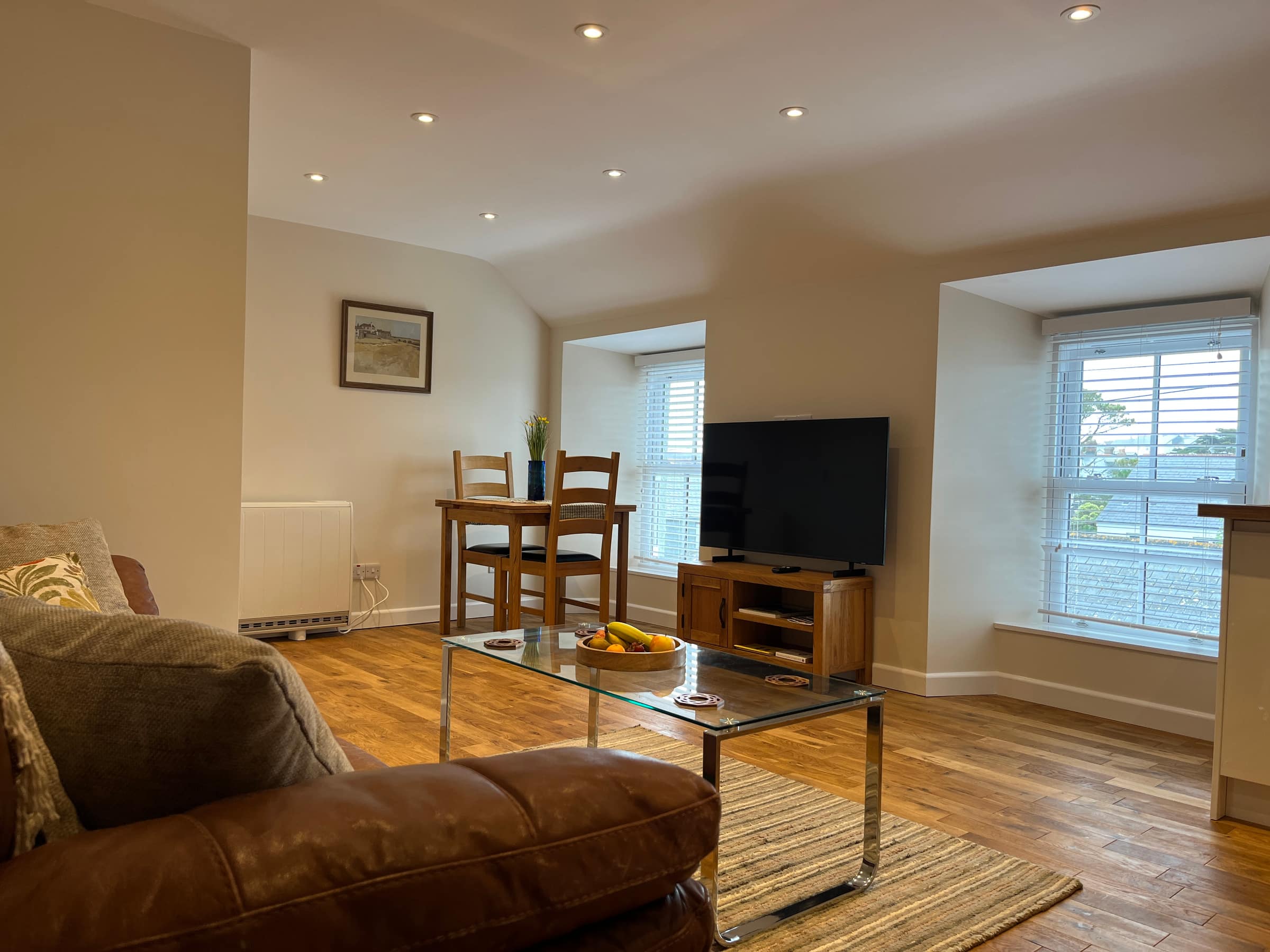 The open-plan living space of The Loft, with views over the rooftops of St Just
