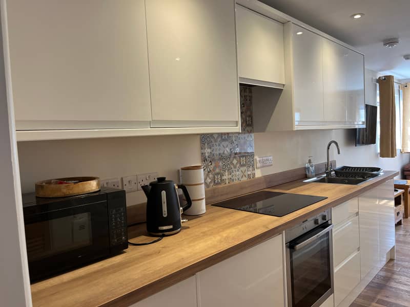 Kitchen worktop with hob, oven and sink